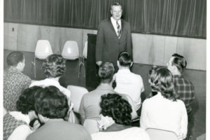 U. Alexis Johnson '31, deputy undersecretary of state talks to students in Playmill Theater at Occidental College, December 6, 1961
